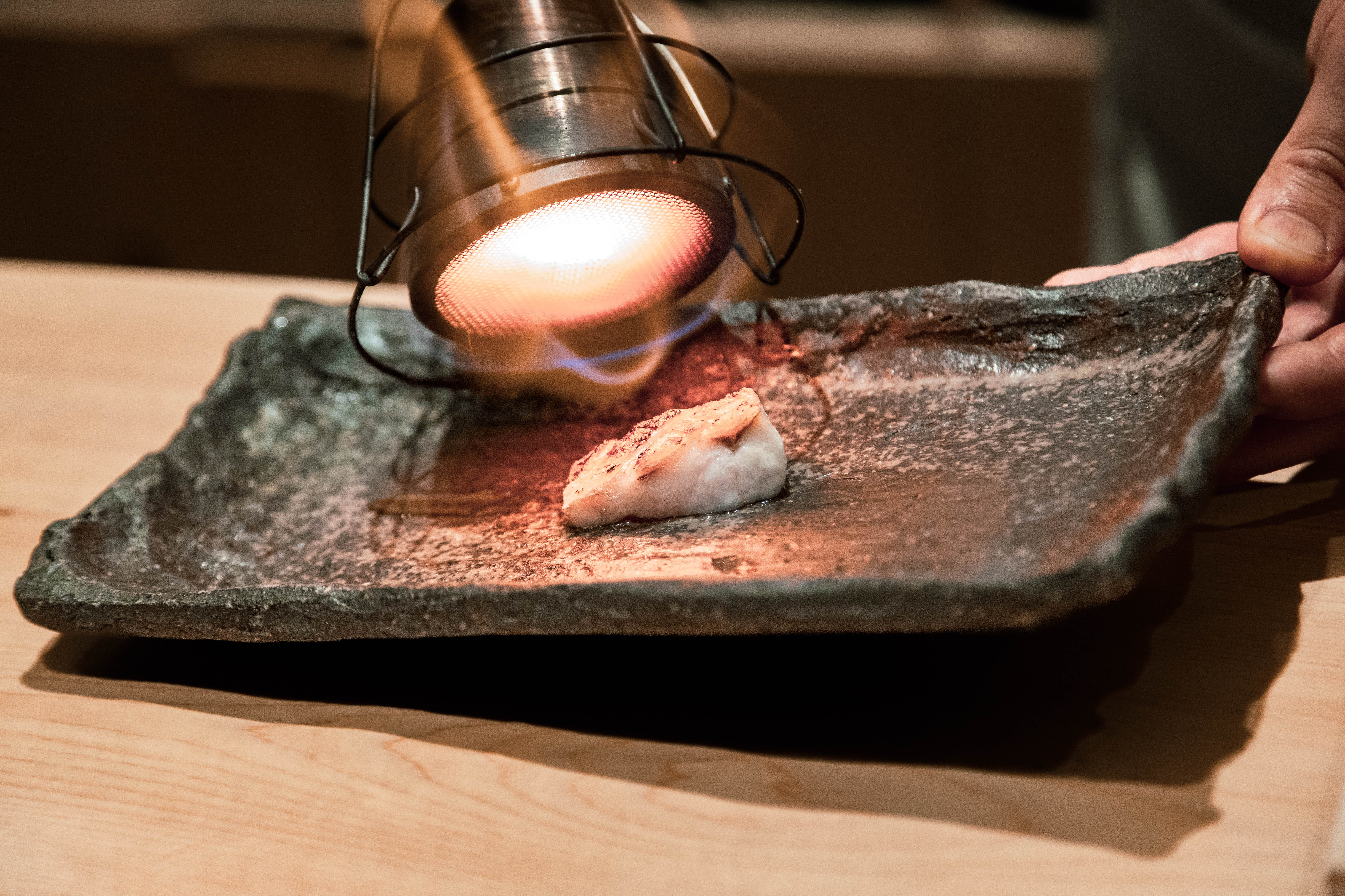 A course being finished at Sushi Amane